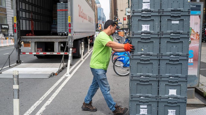 NEW YORK, NEW YORK - JULY 28: A man moves merchandise from a truck in Manhattan on July 28, 2022 in New York City. The Commerce Department said on Thursday that the nation's Gross Domestic Product (GDP) fell 0.2 percent in the second quarter. With two GDP declines in a row, many economists fear that the United States could be entering a recession. (Photo by Spencer Platt/Getty Images